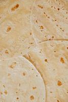 Texture of thin traditional freshly baked homemade oriental bread photo