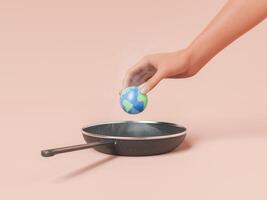 Hand holding planet over hot frying pan photo