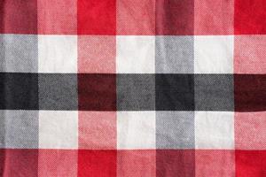 Red black and white checker pattern textile photo