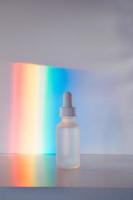 Face serum in front of rainbow photo