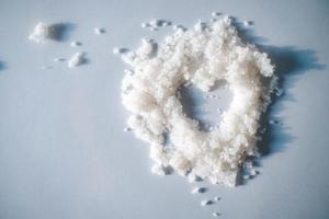 Heart in a white body scrub with bits of shimmer photo