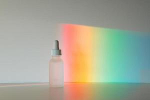 Face serum in front of rainbow photo