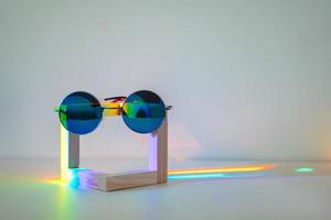 Sunglasses with rainbow reflection photo