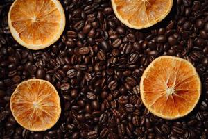 Orange slices on coffee beans photo