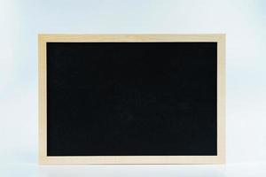 Blank chalk board sign on white background photo