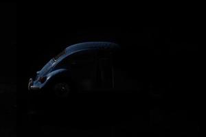 blue car in the shadows