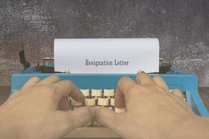 Text typed on an old typewriter - Resignation letter. Work concept. photo