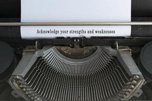 Motivational and inspirational quote typed on an old classic typewriter. photo