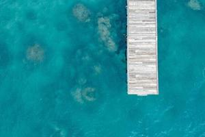 Top view of jetty with clear sea water photo