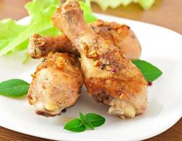 Grilled chicken legs and vegetables photo