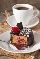 Sweet dessert fruitcake with a cherry photo