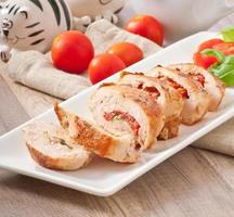 Grilled chicken breast stuffed with basil, tomato and garlic photo