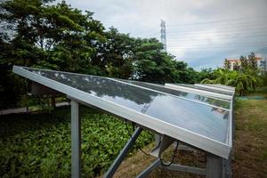 Solar panels on a country hillside on a bright sunny day providing sustainable renewable energy source to the local residents alternative photo