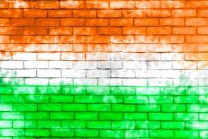 Colorful brick wall background. Walls painted with the India flag color. photo