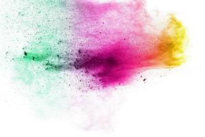 abstract multicolored dust splatter on white background.Freeze motion of color powder explosion on white background. photo