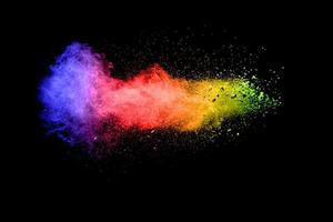 Multicolored powder explosion on black background. photo