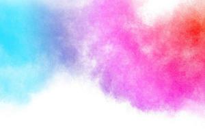 Multicolored powder explosion on white background. photo