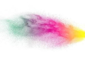 Multicolored particles explosion on white background. Colorful dust splatter on white background. photo