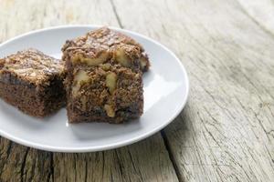 chocolate brownie cake on a wooden table photo