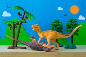 Dinosaur fight scene on wild models background photo