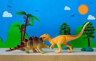 Dinosaur fight scene on wild models background photo