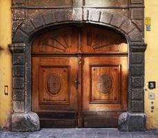 Historical antiques wood door with stone arches in Salzburg, Austria, Europe photo