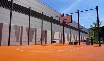 Basketball court outdoor public environment in the school in Summer sunny day, vienna, austria, Europe photo