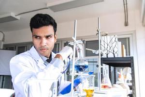 Young scientists or researchers doing chemical research in laboratory. Scientist discovering new drug or vaccine. photo