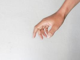 Close-up of hands showing gestures on textured background. photo