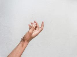 Close-up of hands showing gestures on textured background. photo