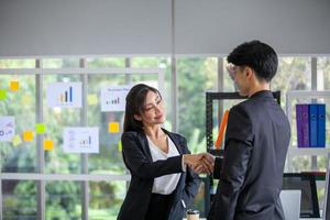 Teamwork Deal Cooperation Partnership business people shaking hands, Shaking hands of two business people in the office photo