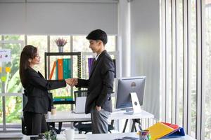 Teamwork Deal Cooperation Partnership business people shaking hands, Shaking hands of two business people in the office photo