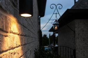 Night home lighting fixture with pool in background photo