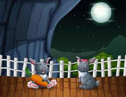 Cute rabbits cartoon enjoying in the night landscape vector