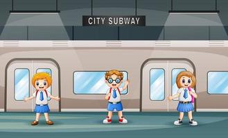 Cartoon of school children in a train station vector
