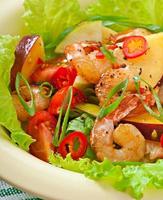 Shrimp salad with peaches, tomato, avocado and lettuce photo