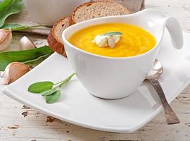 Cream of pumpkin soup with sour cream sauce photo