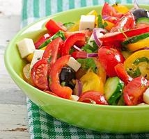 Greek salad with feta, cherry tomatoes and black olives photo