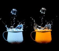 Colorful glass of water with splashing photo