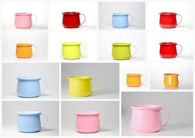 A colorful set of colored zinc mugs or cups. photo