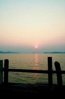 A wooden walkway that stretches into the sea. vacation travel concept photo