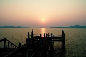 A wooden walkway that stretches into the sea. vacation travel concept photo