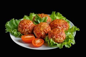 Appetizing meat balls in tomato sauce on a dark background. High protein dish. photo