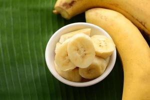 Ripe banana sliced in a cup photo