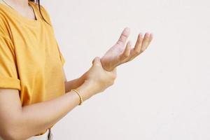 Woman holding her wrist pain from using computer, office syndrome photo