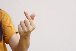 Asian woman's hand a small heart symbol photo