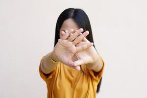 Woman raised her hand for dissuade, campaign stop violence against women photo