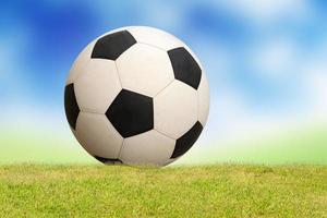 soccer ball on green grass photo