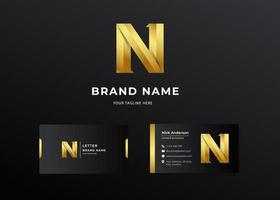 Letter N gold luxury gradient logo with business card design vector