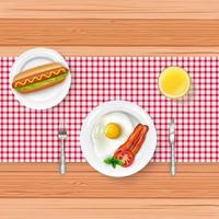 Breakfast menu with fried egg and fast food on wooden table